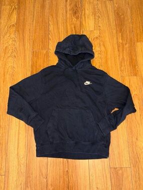 Black Nike hoodie with white swoosh